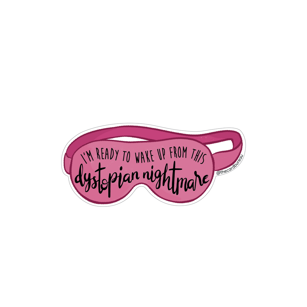Sticker featuring a pink sleep mask with the phrase “I’m ready to wake up from this dystopian nightmare” in playful script.