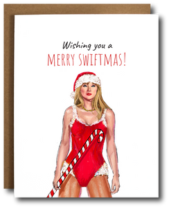 Holiday card featuring Taylor Swift in a red Santa suit holding a candy cane, with the text 'Wishing you a Merry Swiftmas' in festive font.